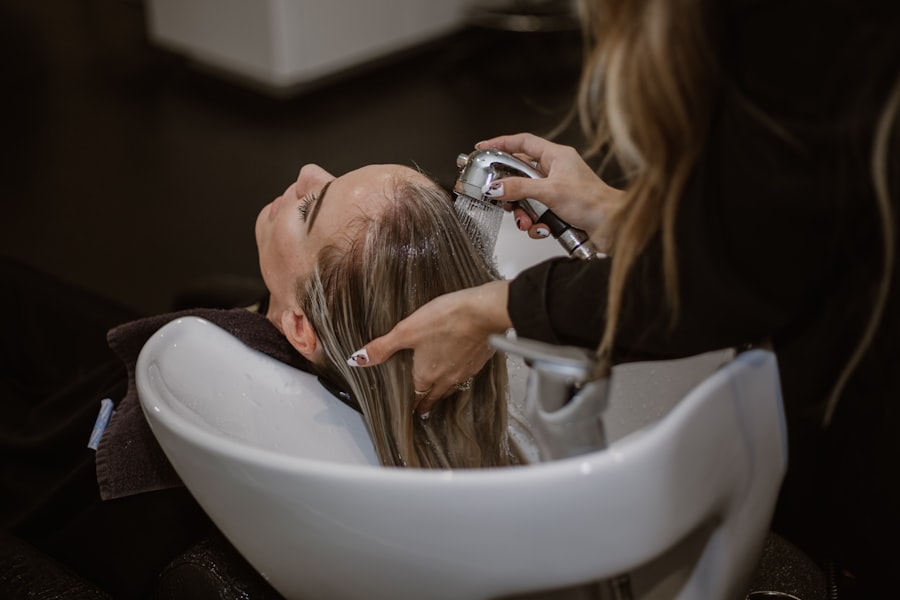 Hairdresser washing a client's hair in a salon