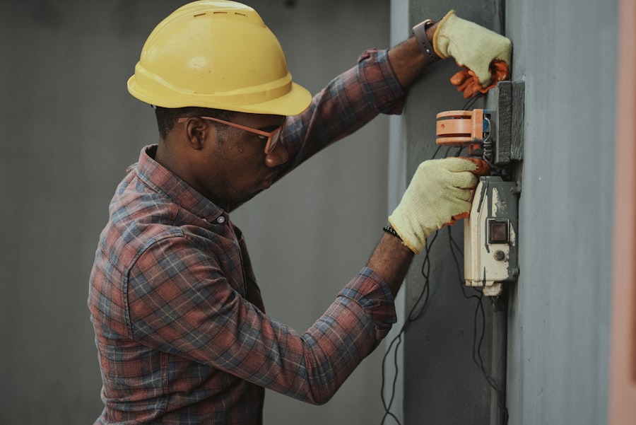 Electrician working on a wiring panel